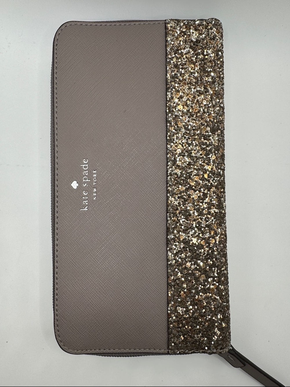 kate spade taupe and gold glitter zip wallet